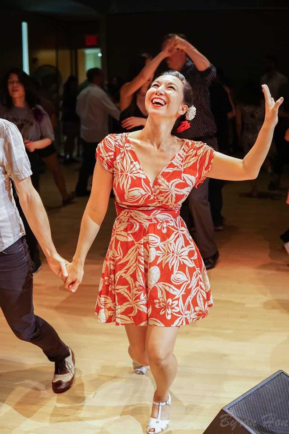 Stina Dallons laughing on the dance floor at a swing dance social