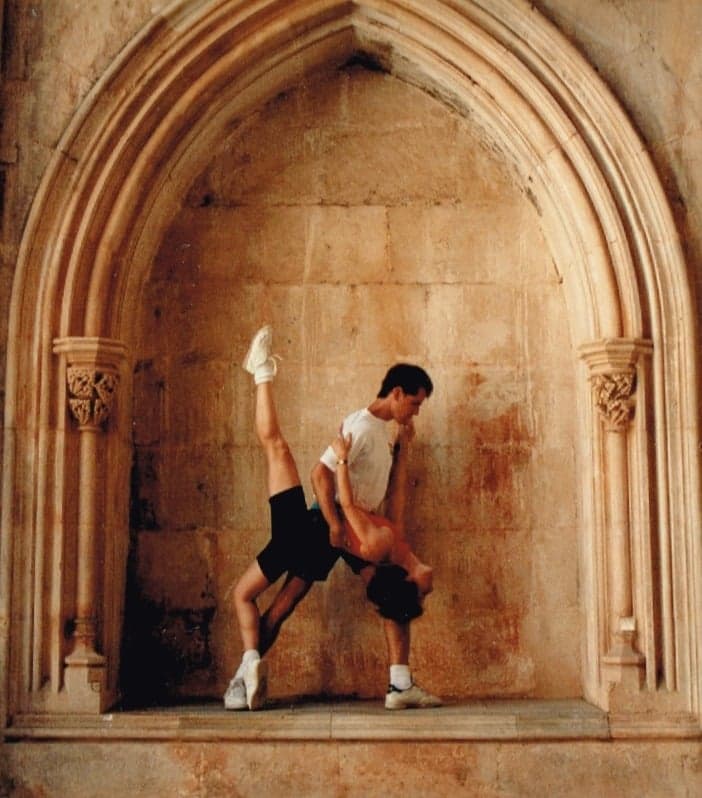 Roger and Mané Plaut in a dance pose inside a stone archway